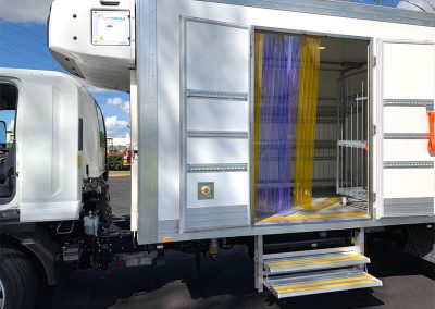 detail of refrigerated truck body side door with steps